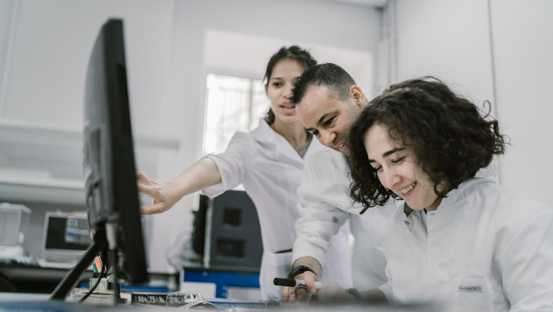 Researcher working with laboratory equipment during drug discovery