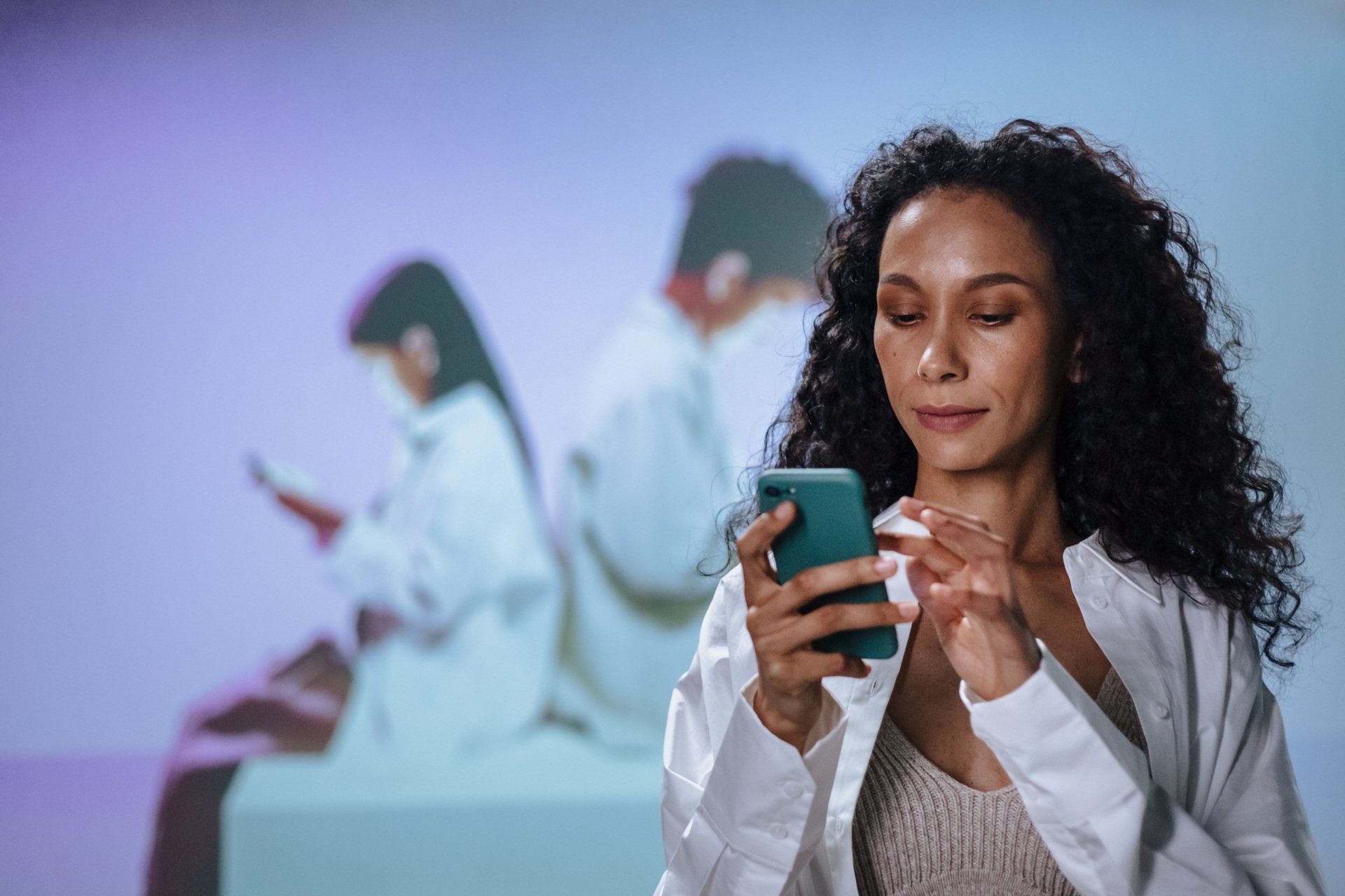 Scientist using a mobile device in a laboratory setting